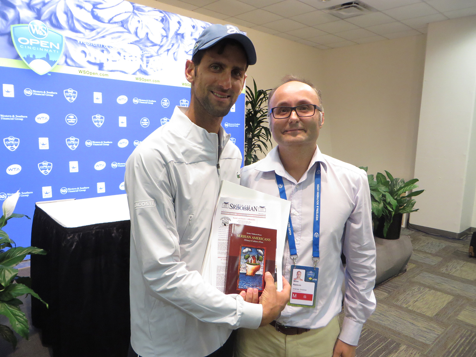 Novak Djokovic, Serbian Tennis Player, and Milos Rastovic, Cultural Outreach Coordinator of the SNF, with SNF Gifts