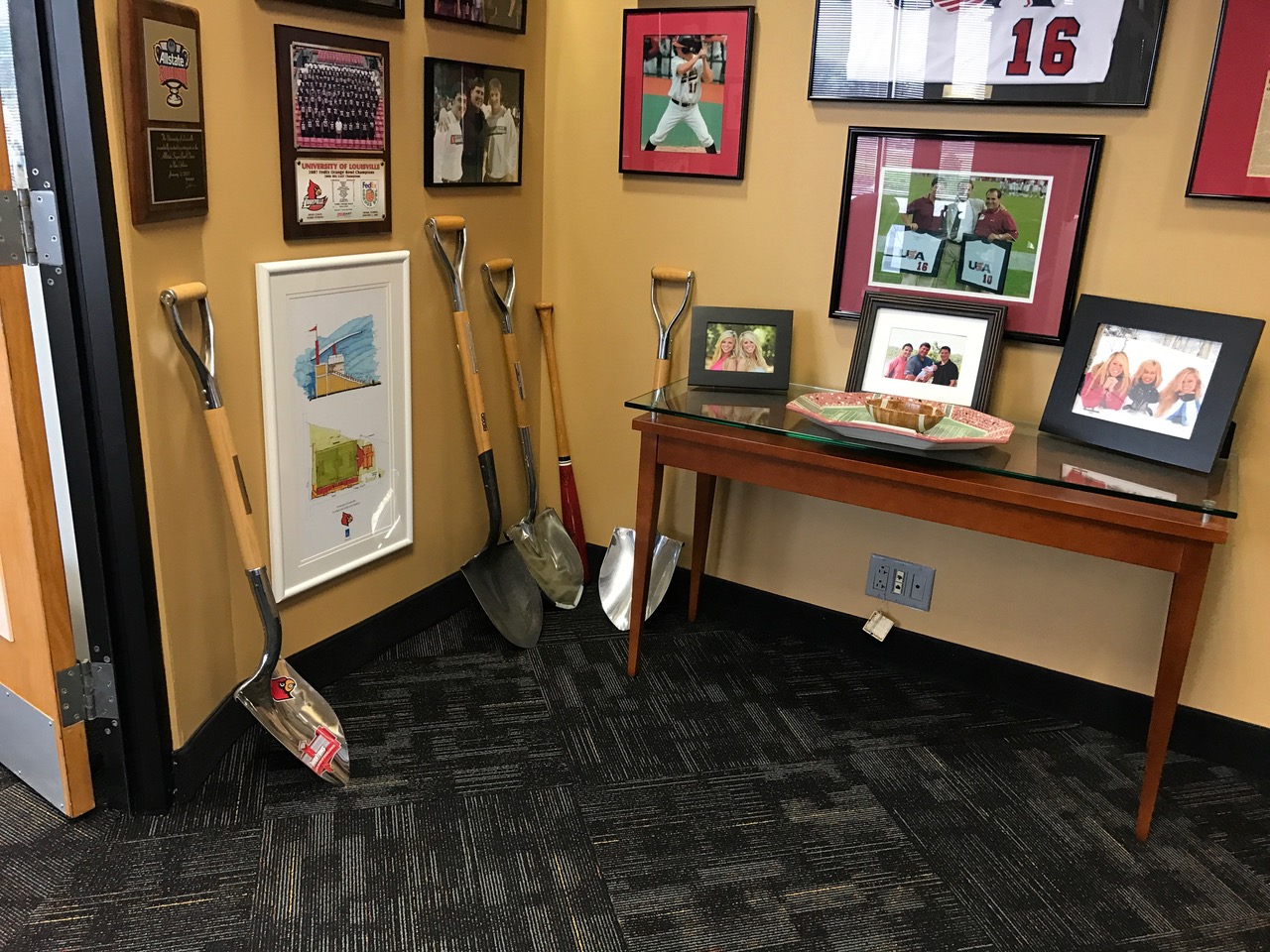 Family photos, athletic moments and a collection of shovels symbolizing the growth and expansion during Tom Jurich’s reign