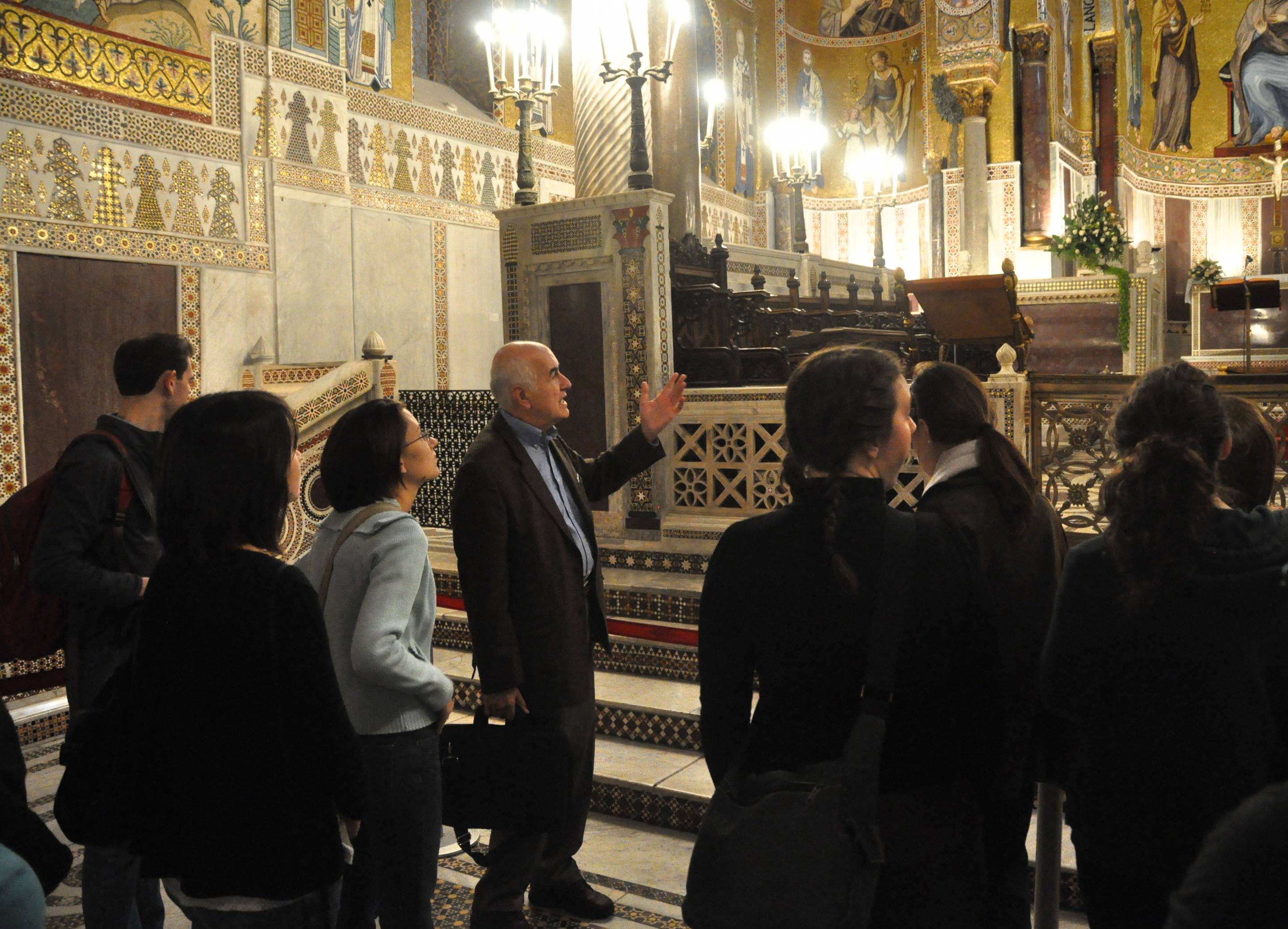 Ćurčić (fourth from left), professor of art and archaeology, emeritus, who specialized in medieval architecture, is shown in 2010 leading students through the Palatine Chapel in the Norman palace in Palermo, Sicily. Photo courtesy of Alex Walthall